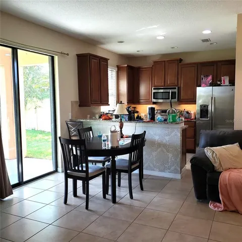 a view of a dining room with furniture