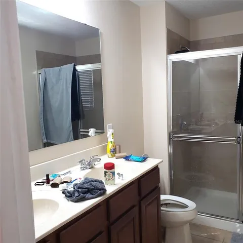 a living room with furniture and a mirror