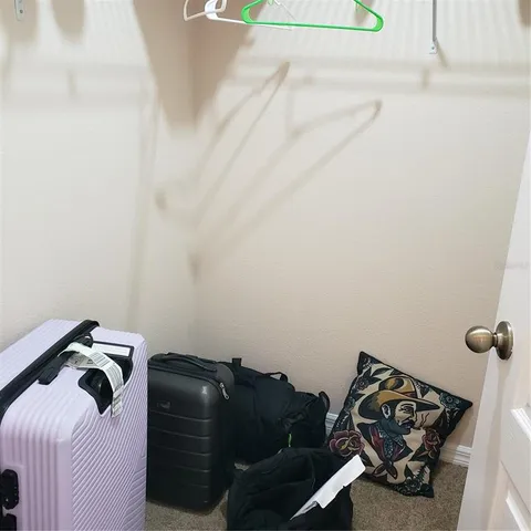a bathroom with a sink vanity mirror and toilet