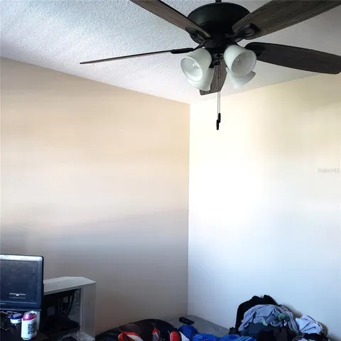 a bedroom with a bed and the view of cupboard