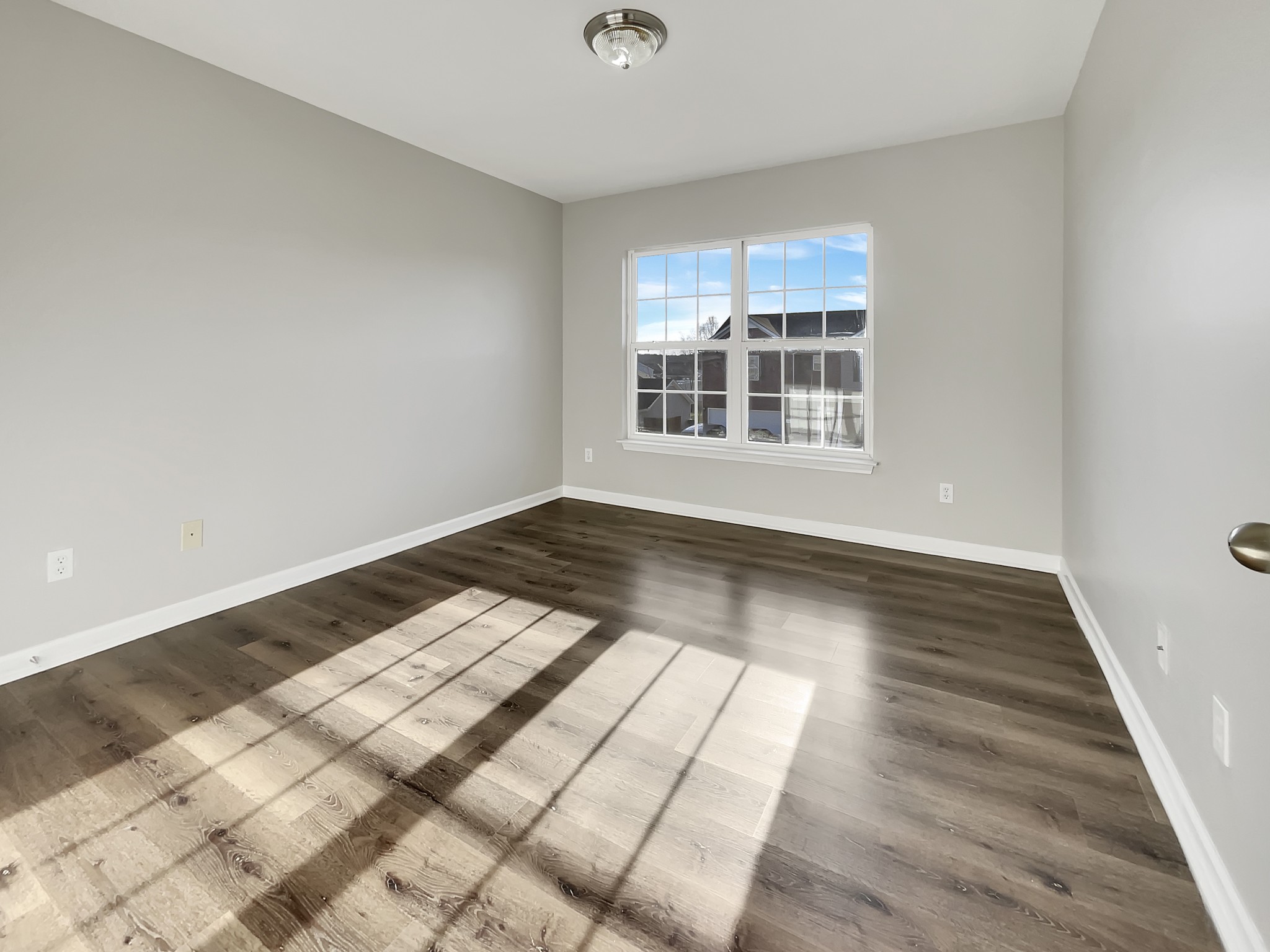 2033 Red Jacket Trace Spring Hill, TN 37174 - Photo 11 of 20 a view of wooden floor and windows in a room