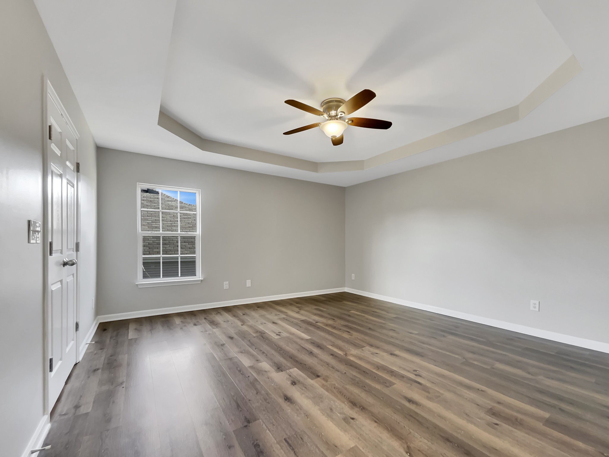 2033 Red Jacket Trace Spring Hill, TN 37174 - Photo 15 of 20 a view of an empty room with a window and wooden floor