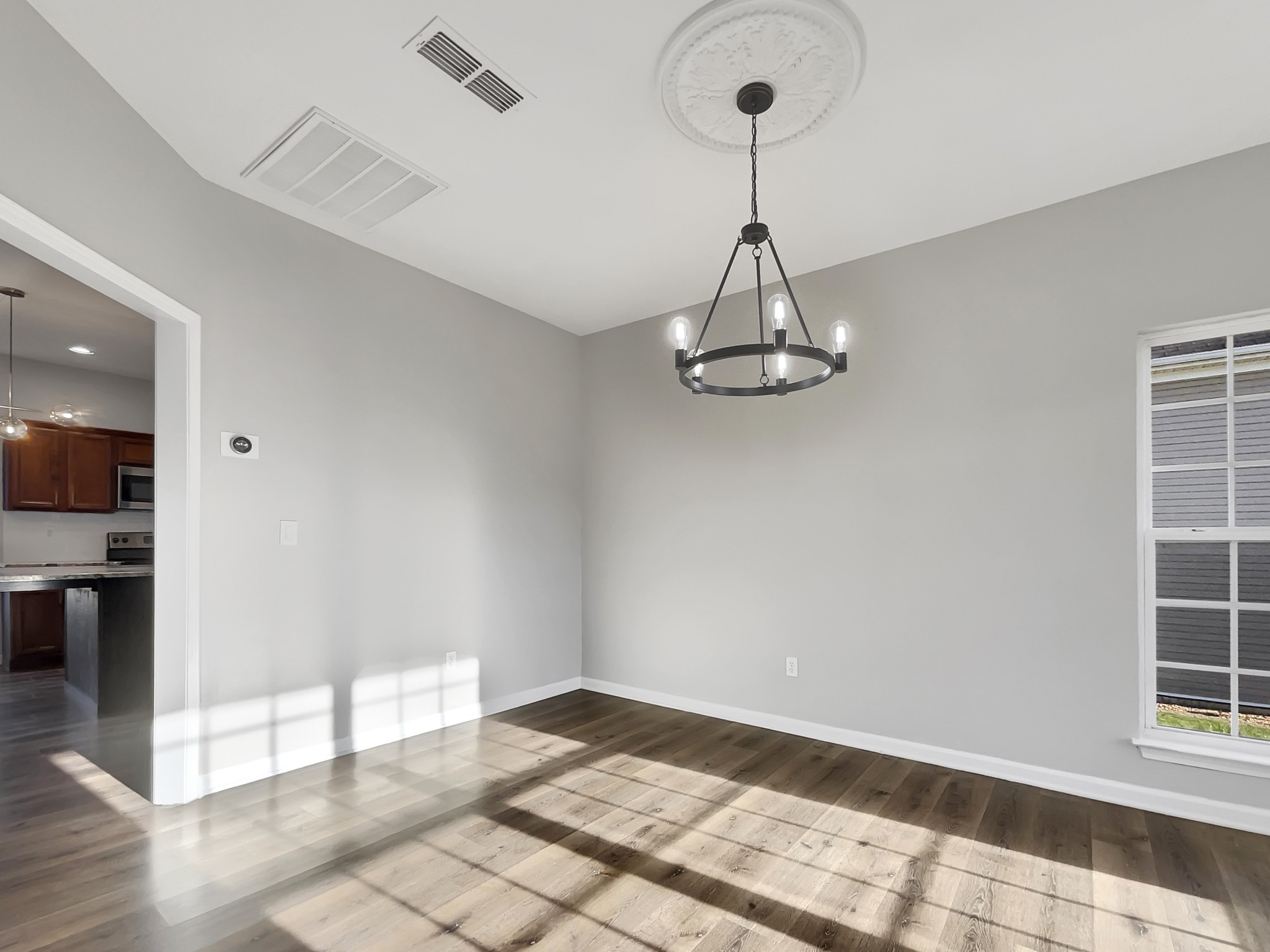 2033 Red Jacket Trace Spring Hill, TN 37174 - Photo 6 of 20 a view of empty room with wooden floor and fan