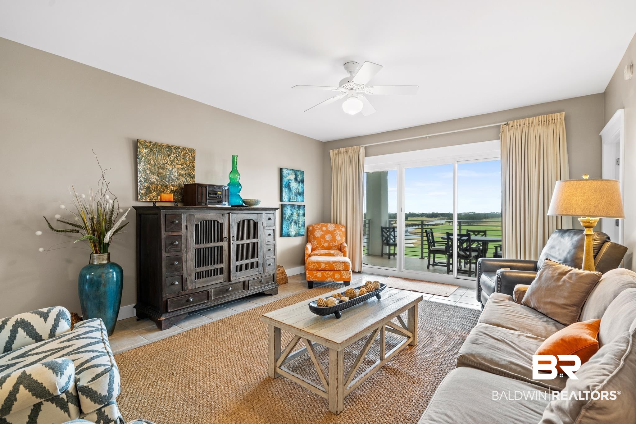 815 Plantation Road, Unit 405 Gulf Shores, AL 36542 - Photo 10 of 39 Tiled living room with ceiling fan