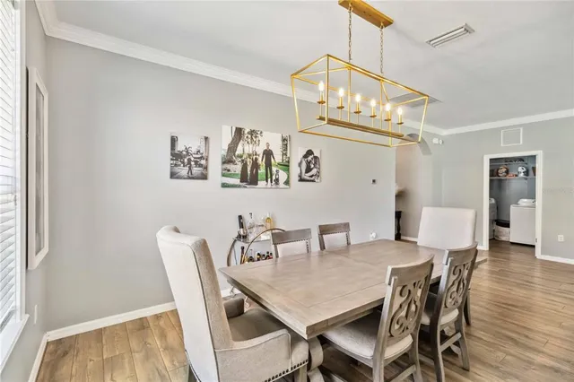 a view of a dining area with furniture and a clock