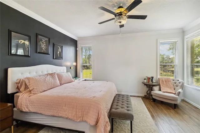 a bathroom with a tub sink shower and mirror