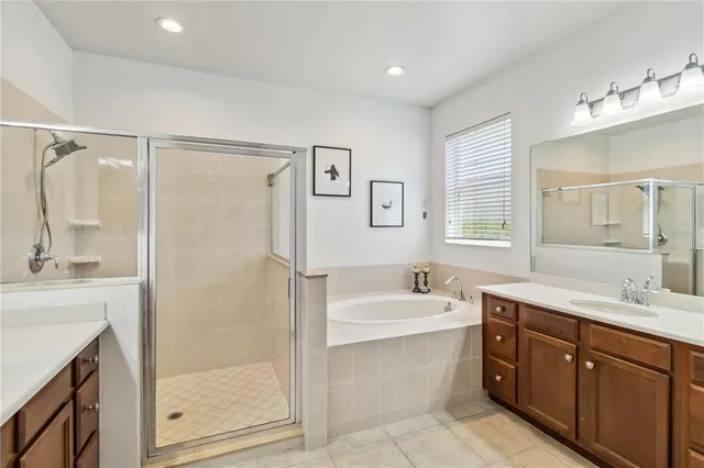 a bathroom with a sink double vanity and shower