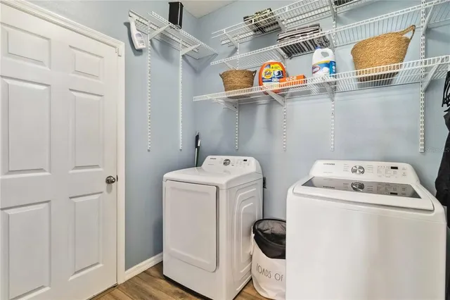 a view of a swimming pool and lounge chairs