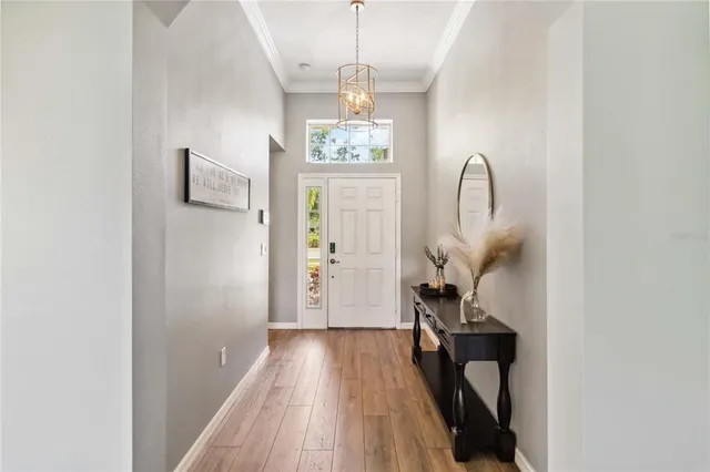 a view of a room with wooden floor and staircase