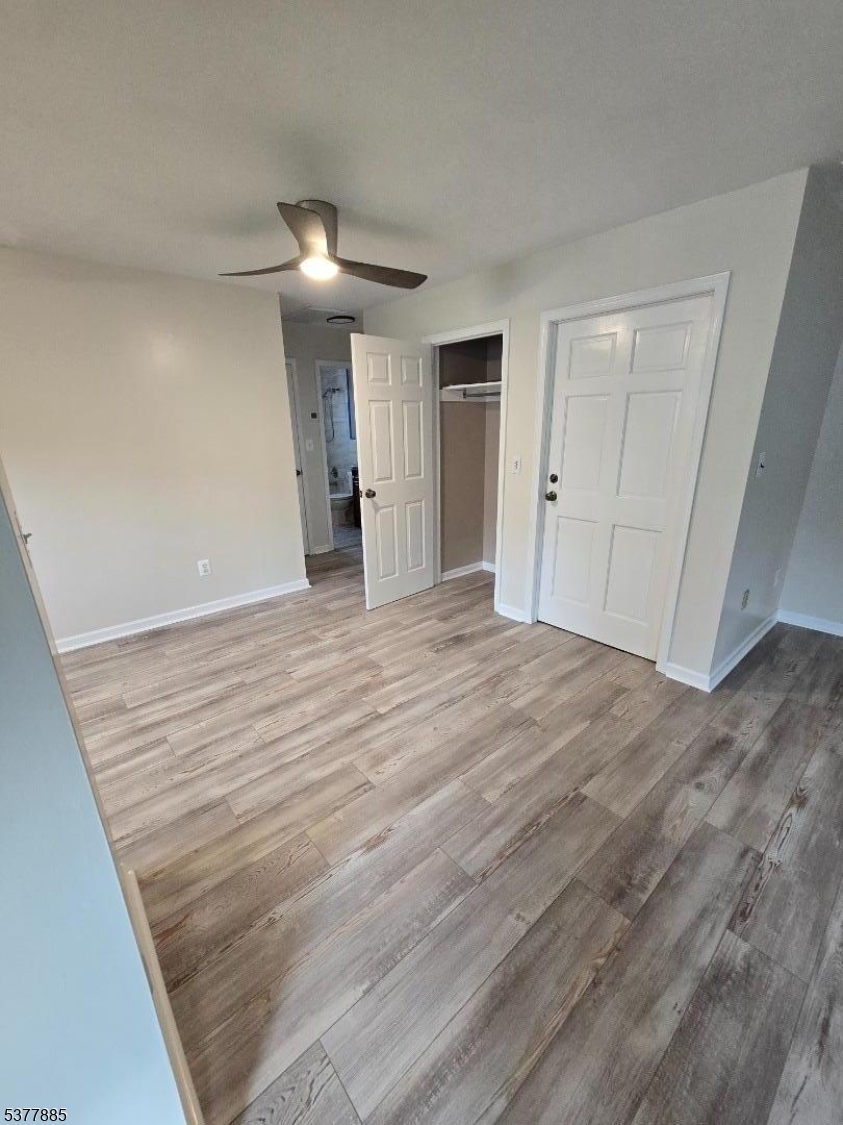 759 Lafayette Avenue, Unit 2 Hawthorne, NJ 07506 - Photo 2 of 13 a view of empty room with wooden floor