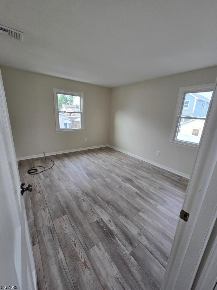 759 Lafayette Avenue, Unit 2 Hawthorne, NJ 07506 - Photo 7 of 13 an empty room with windows