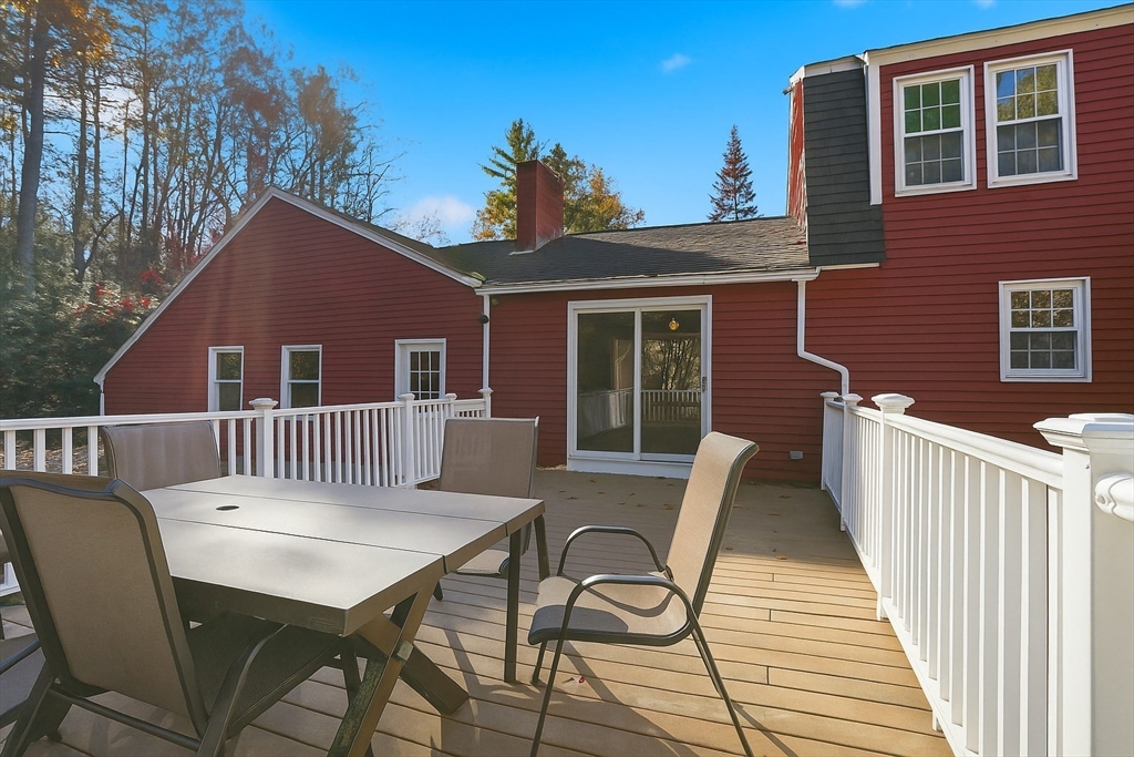 254 Ash Swamp Road Newmarket, NH 03857 - Photo 17 of 30 a view of a patio with a table and chairs