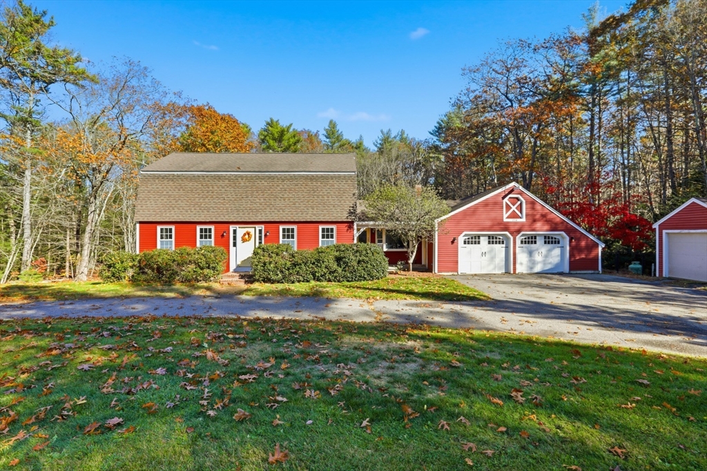 254 Ash Swamp Road Newmarket, NH 03857 - Photo 2 of 30 a front view of a house with a yard