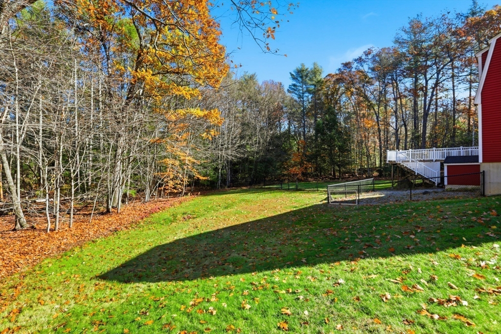254 Ash Swamp Road Newmarket, NH 03857 - Photo 22 of 30 a view of a backyard with large trees