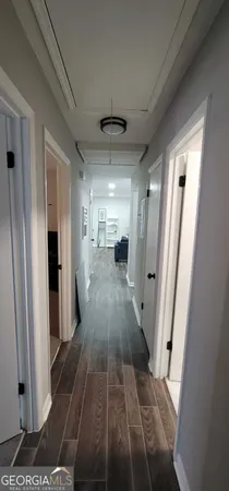 a view of entryway and kitchen