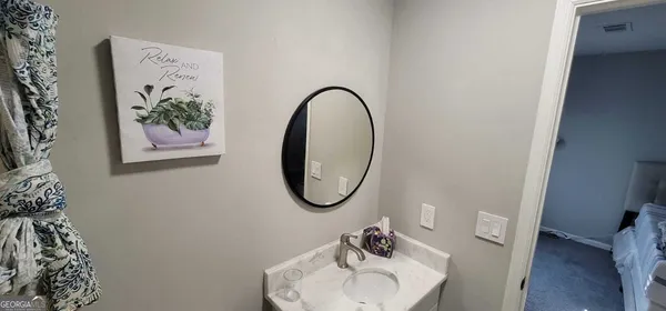 a bathroom with a toilet and a sink