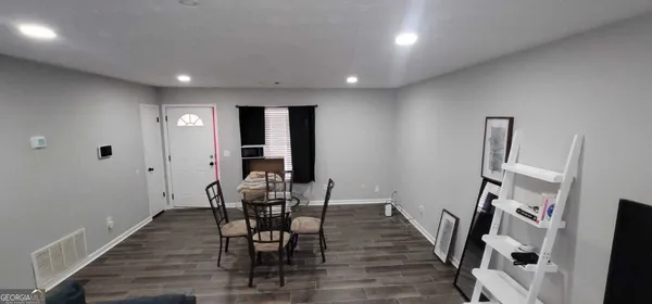 a view of a livingroom with furniture and wooden floor
