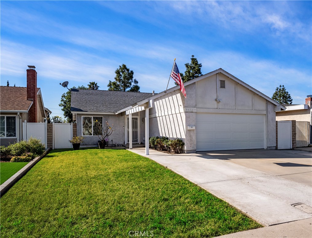 4652 Abbotswood Circle Irvine, CA 92604 - Photo 1 of 19 a front view of a house with a yard