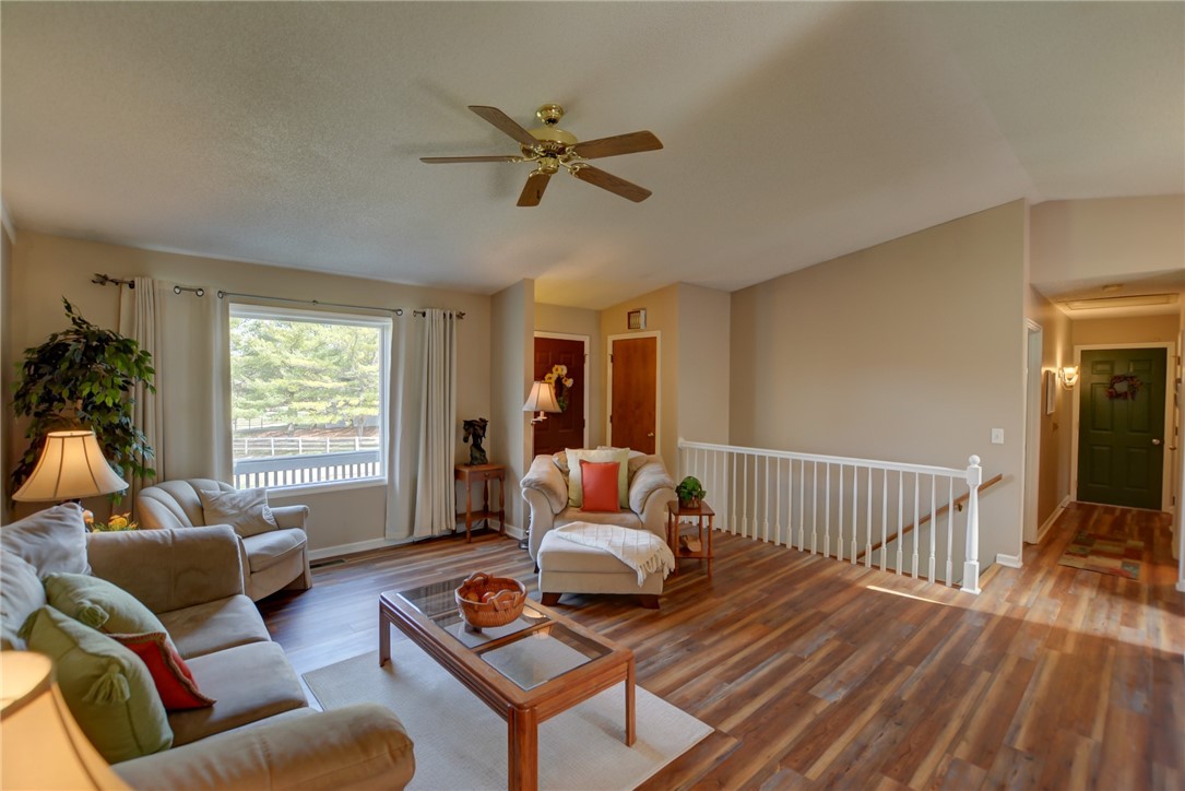 4095 West Rock Springs Road Decatur, IL 62522 - Photo 6 of 48 a living room with furniture and a window