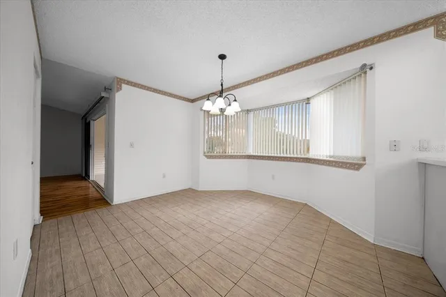 a kitchen with sink stove and refrigerator