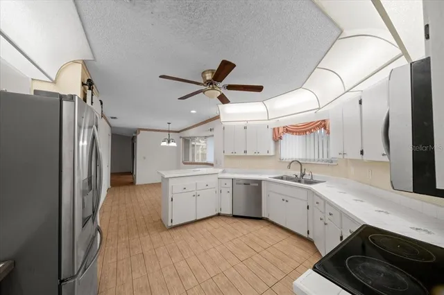 a bathroom with a double vanity sink and a toilet