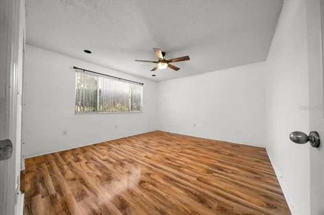 a front view of house with yard and trees