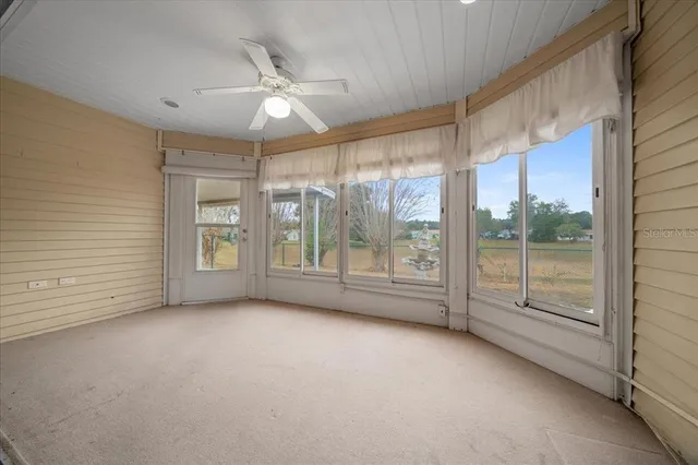 a front view of house with yard and trees