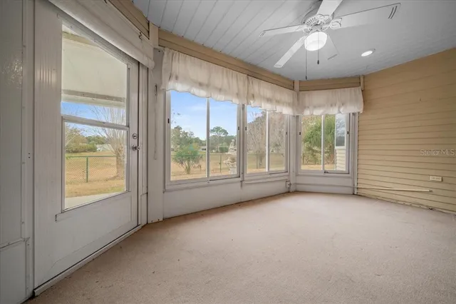 a house that has a tree in front of it
