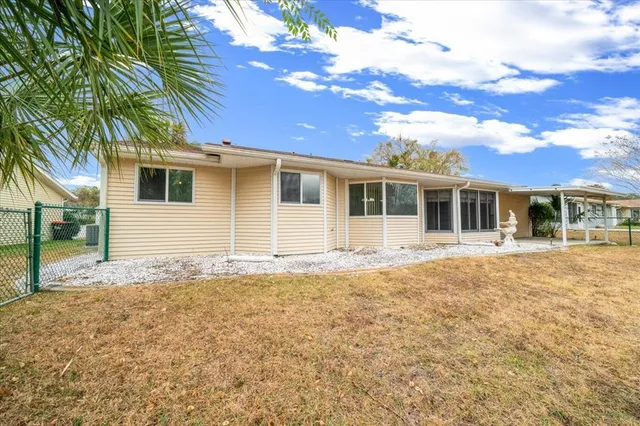 an aerial view of residential houses with outdoor space and street view
