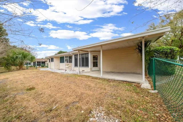 an aerial view of residential houses with outdoor space and river