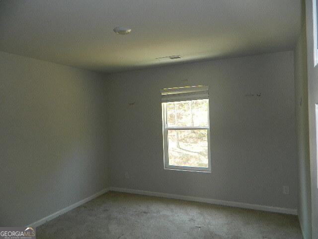 3790 River Rock Road Lithonia, GA 30038 - Photo 11 of 14 an empty room with a window