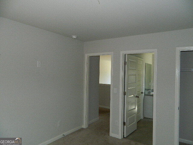 3790 River Rock Road Lithonia, GA 30038 - Photo 12 of 14 a bathroom with a shower and a sink