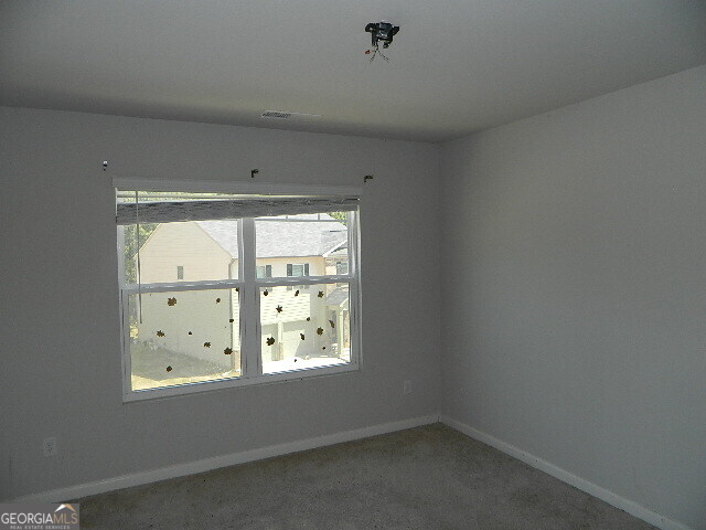 3790 River Rock Road Lithonia, GA 30038 - Photo 13 of 14 an empty room with windows