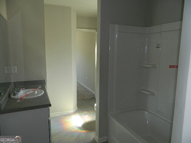 3790 River Rock Road Lithonia, GA 30038 - Photo 14 of 14 a bathroom with a bathtub