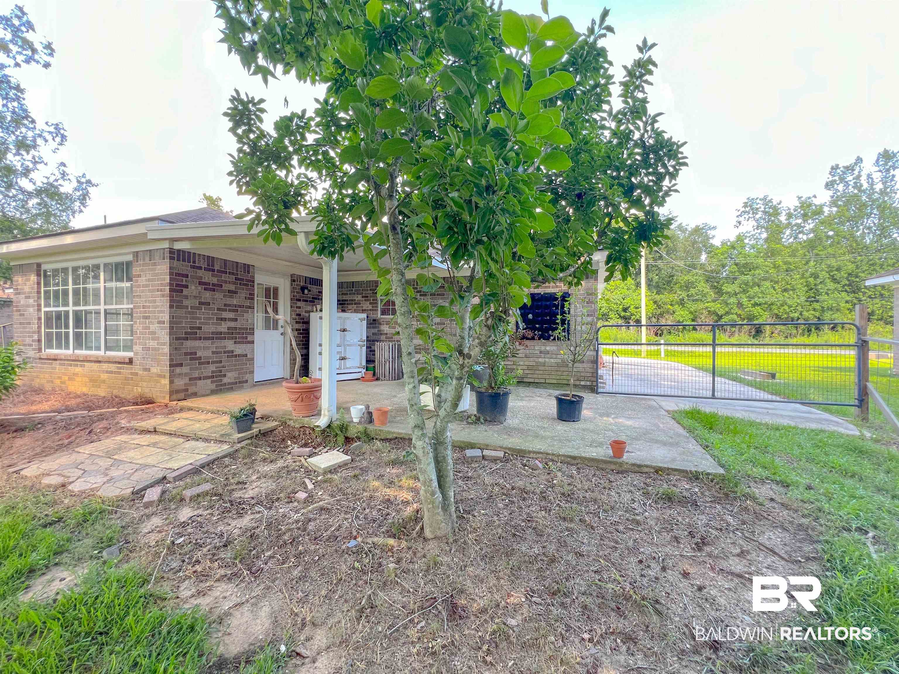 1200 South Juniper Street Foley, AL 36535 - Photo 19 of 23 Single story home with a patio and a front lawn