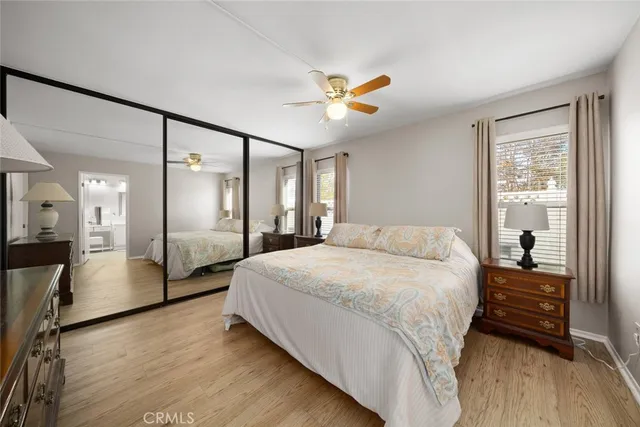 a spacious bedroom with a bed and a walk in closet