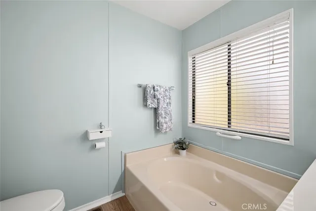 a bathroom with a sink a toilet and tub