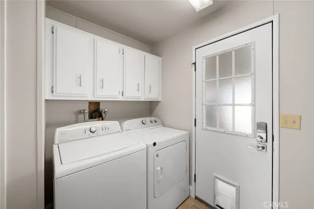 a view of cabinets and washer dryer