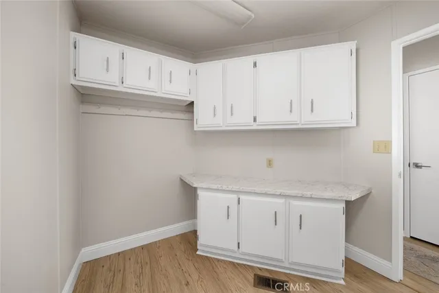 a view of cabinets with wooden floor