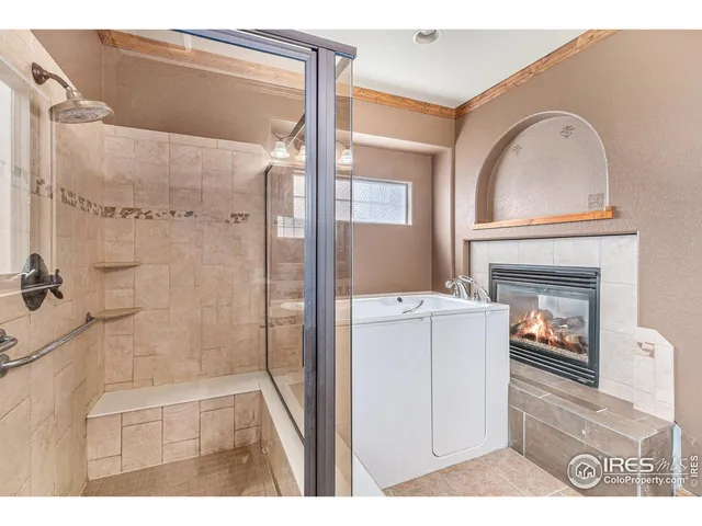 a bathroom with a granite countertop sink mirror vanity and toilet