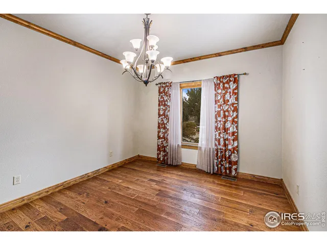 a view of a livingroom with furniture and a flat screen tv