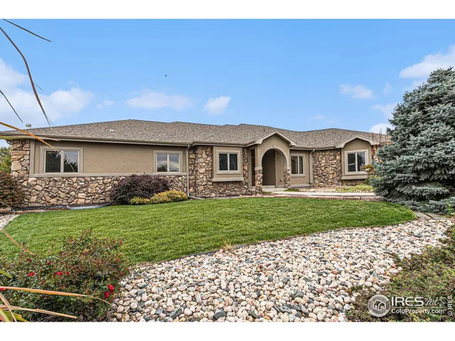 a kitchen with stainless steel appliances granite countertop a sink stove and wooden cabinets