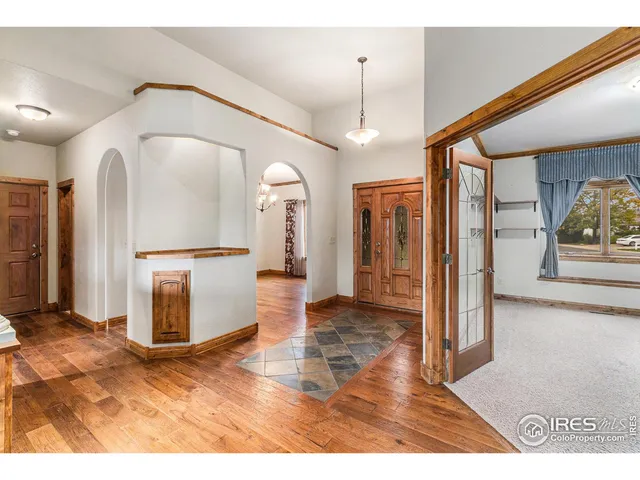 a view of kitchen with stainless steel appliances kitchen area and hall