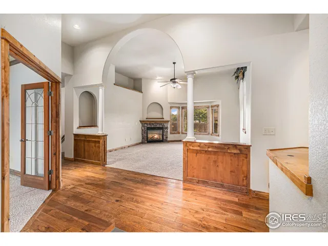 a kitchen with granite countertop wooden cabinets a sink and dishwasher