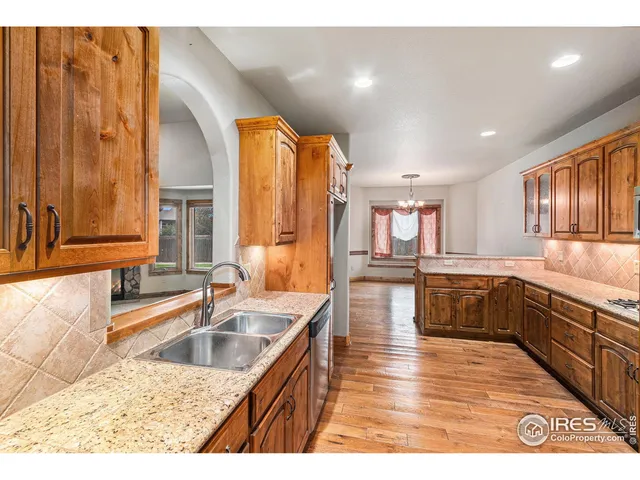 a view of empty room with fireplace and fan