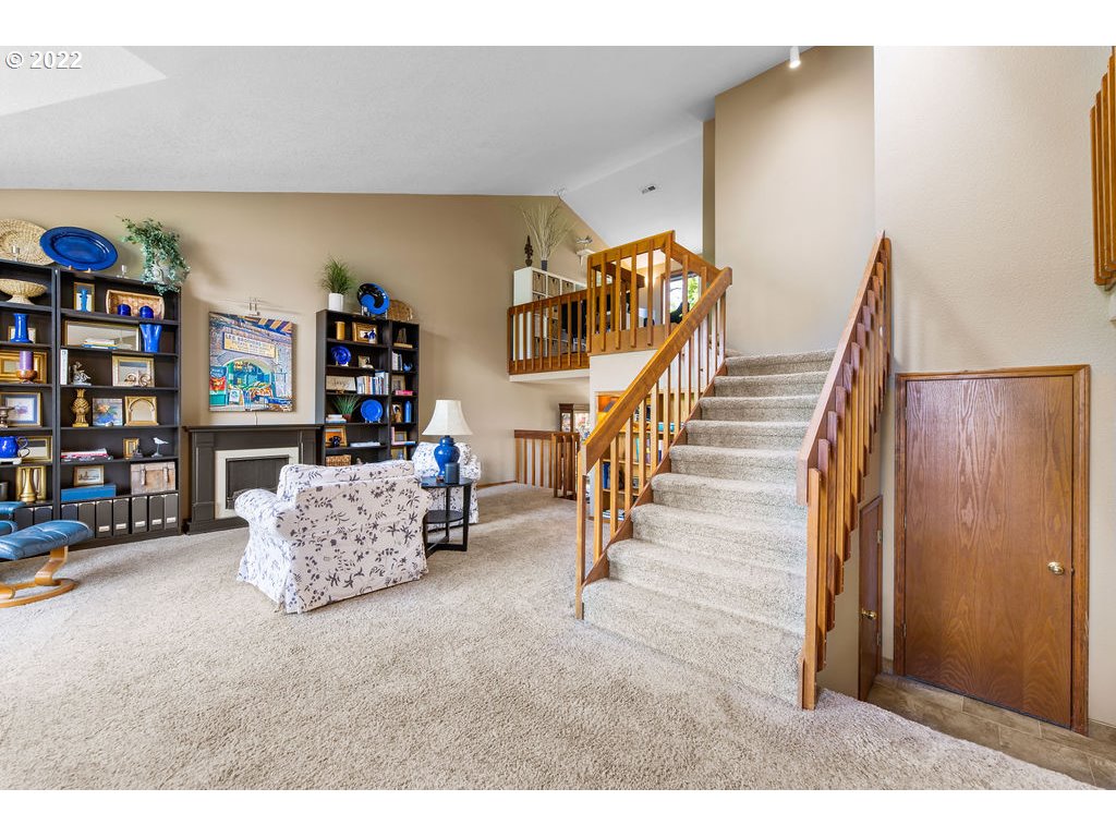 3720 Northeast 160th Street Ridgefield, WA 98642 - Photo 5 of 32 a living room with furniture and a book shelf