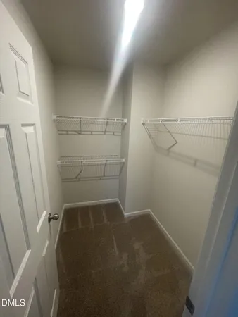 a view of storage and utility room with empty racks