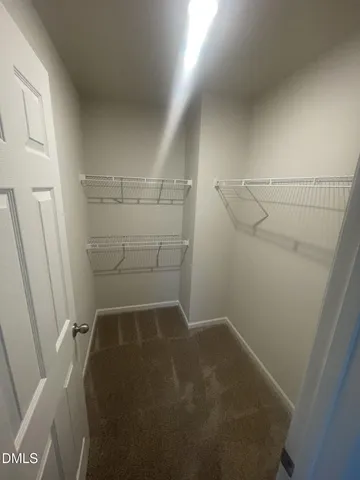 a view of storage and utility room with empty racks