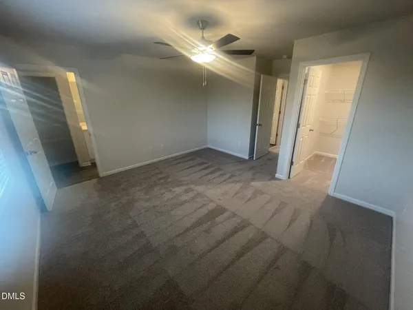 an empty room with a bathroom