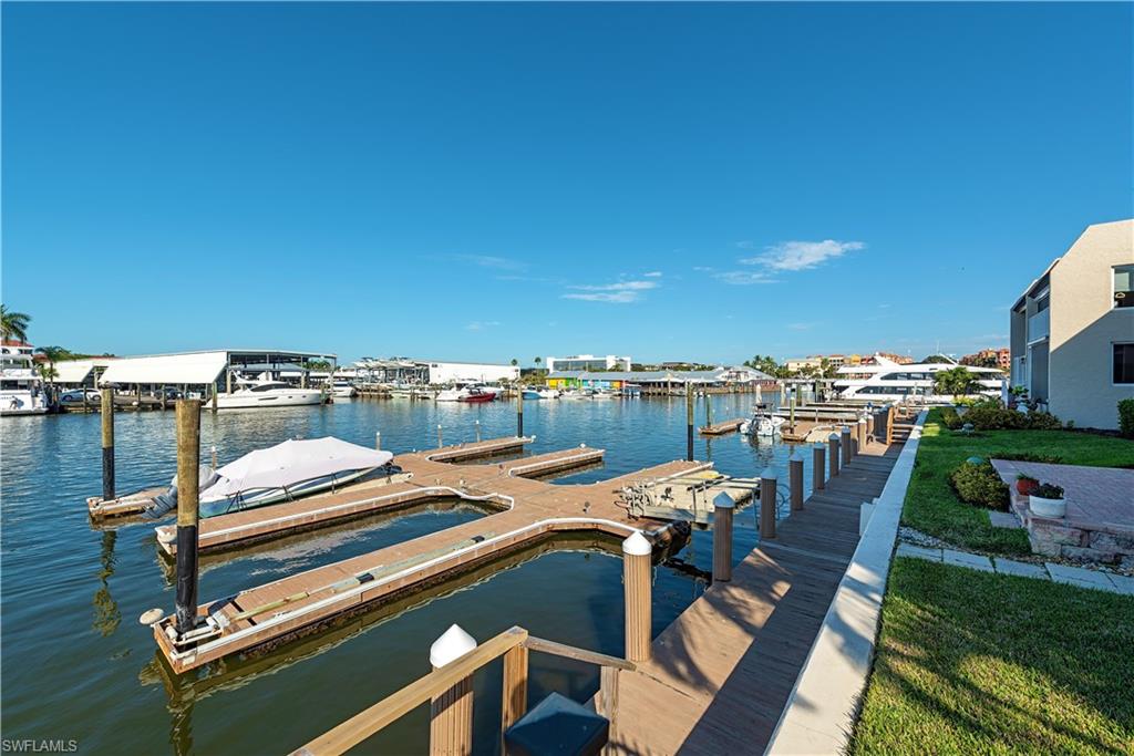 800 River Point Drive, Unit 207 Naples, FL 34102 - Photo 12 of 12 a view of a terrace with seating area